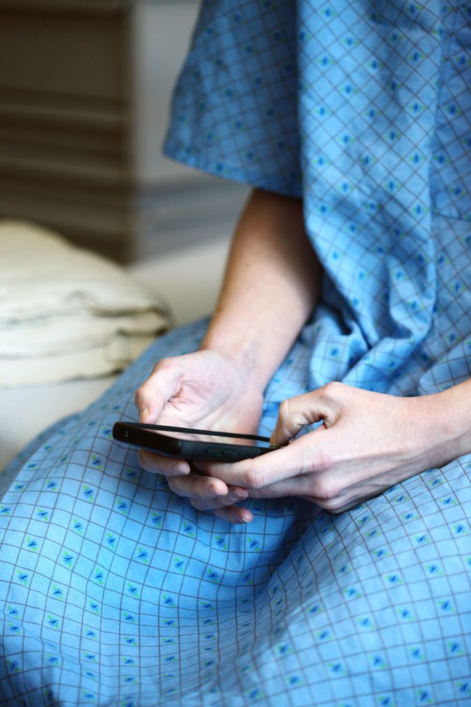 Patient using a phone in the hospital
